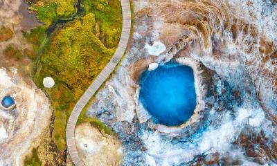 霜下之火 | 赫韦拉韦利尔的布拉赫维尔地热池, 冰岛 (© Juan Maria Coy Vergara/Getty Images)